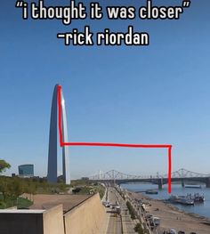 a red line on the side of a road with a bridge in the background that says, i thought it was closer