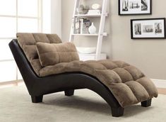 a brown and black chaise lounger in a living room