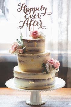 a three tiered cake sitting on top of a table