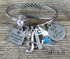 "This is the perfect gift for any special friend or sister in your life who is turning the BIG 40, 50, or 60! This listing is for ONE 60mm stainless steel rhinestone expandable bangle, that expands to fit a wrist size up to 8\". Dangling from the bangle bracelet will be *Your choice of stainless steel laser charm - Friends are family we choose, Friends are the Sunshine of Life, Always my sister forever my friend, Live Laugh Love, or Remember the Moments. * antique silver filigree rhinestone hear Bridal Bouquet Charms, Remembrance Jewelry, Girl Friendship, Friend Birthday Gift, Birthday Keepsakes, Sister Jewelry, 50th Birthday Gifts, 40th Birthday Gifts, Best Friend Birthday