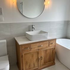 a bathroom with a sink, toilet and bathtub