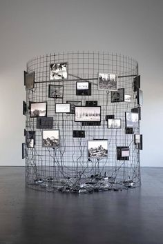 a sculpture made out of wire with pictures on it