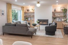 a living room filled with furniture and a fire place in the middle of a room