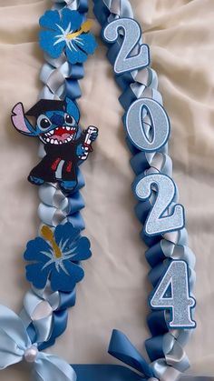 a blue and white birthday decoration with flowers