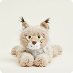 a stuffed animal that looks like a cat with big ears and claws on it's head