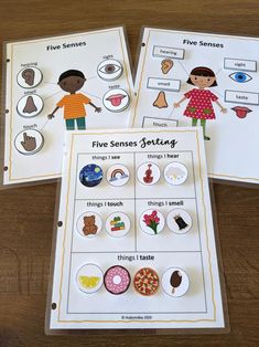 three different types of buttons on top of a wooden table next to an activity book