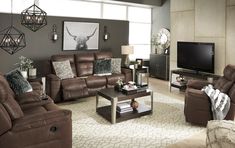 a living room filled with furniture and a flat screen tv