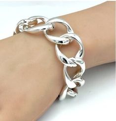 Indulge in the timeless elegance of our 7.5-inch Curb Link Bracelet, meticulously crafted from premium 925 sterling silver. This exquisite piece features a distinctive large spring ring clasp, ensuring a secure and stylish closure. Its hollow design makes it lightweight, allowing for comfortable wear throughout the day without sacrificing durability or charm. Each bracelet is stamped with '925' as a hallmark of its authenticity and quality, ensuring that you are acquiring a genuine sterling silv Luxury Elegant Sterling Silver Bracelet With Clasp, Elegant Luxury Sterling Silver Curb Chain Bracelet, Luxury Link Bracelets With Sterling Silver Clasp, Adjustable Link Sterling Silver Charm Bracelet, Elegant Sterling Silver Charm Bracelet, Tarnish Resistant, Nickel-free Sterling Silver Link Bracelet, Sterling Silver Link Bracelet, Tarnish Resistant, Vintage Hallmarked Sterling Silver Charm Bracelet, Hollow Design