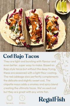 two fish tacos are on a wooden table