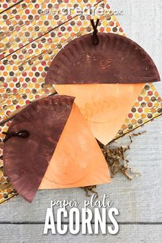 the paper plate acorns are made with brown and orange papers