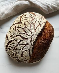 a loaf of bread sitting on top of a white counter