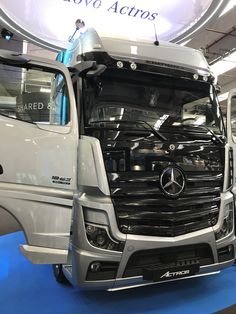 a mercedes semi truck is on display at an auto show