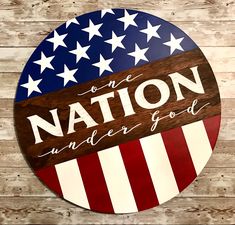 a wooden sign that says, one nation under god on top of an american flag