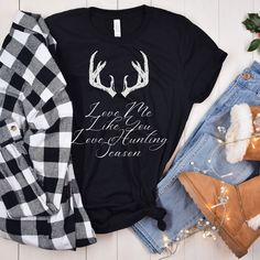 Whether you are shopping for yourself or looking for a gift for the woman in your life, you can't go wrong with this unique shirt.  Love Me Like Hunting Season is an anthem for all those Hunting Widows out there. See sizing chart for unisex t-shirt Care Instructions:  Machine wash: cold (max 30C or 90F); Non-chlorine: bleach as needed; Tumble dry: low heat; Iron, steam or dry: medium heat; Do not dryclean. This classic unisex jersey short sleeve tee fits like a well-loved favorite. Soft cotton and quality print make users fall in love with it over and over again. These t-shirts have-ribbed knit collars to bolster shaping. The shoulders are tapered for a better fit over time. Dual side seams hold the garment's shape for longer.  .: Made with 100% Airlume combed and ring-spun cotton, a light Hunters Wife, Duck Season, Deer Season, Love Me Like, Hunting Season, Unique Shirt, Wife Gift, Love Me, Leisure Wear