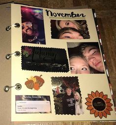 an open planner with pictures of people and the words november on it, sitting on a wooden table