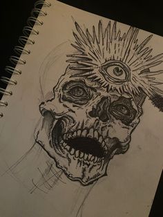 a drawing of a skull with spikes on it's head and an evil eye