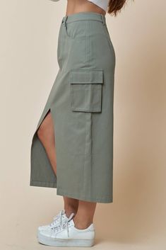 This stylish Cargo Utility Skirt is a great addition to your casual wardrobe. Featuring belt loops, a zip-fly and a button closure, and handy utility pockets, you'll be ready to take on any adventure! All in the comfort of 100% cotton. What are you waiting for? Suit up! Khaki Knee-length Skirt With Pockets, Khaki Cargo Skirt With Side Pockets For Work, Casual Cargo Skirt With Belt Loops For Fall, Green Utility Mini Skirt, Relaxed Solid Cargo Skirt With Pockets, Casual Khaki Cargo Skirt With Pockets, Utility Skirt With Multiple Pockets For Work, Solid Color Relaxed Cargo Skirt With Pockets, Solid Cargo Skirt With Pockets And Relaxed Fit