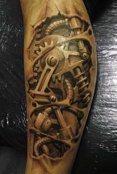 a man's arm with a clock and gears tattoo on it