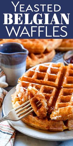 a white plate topped with waffles on top of a blue and white checkered table cloth