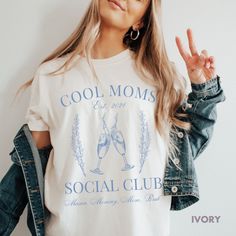 Get ready to be OBSESSED with your new Cool Moms Club Shirt. It's the cutest and most trendy way to emit all those important Old Money Aesthetic and Social Club Vibes! This is the perfect shirt for your group of Mom friends! Great as a  Mothers Day Gift for all the Mamas out there! * Q U I C K * F A C T S * ✺ 100% preshrunk cotton ✺ Wash and dry normally (on cool for best results) * S I Z I N G * ✺ Models are wearing size XL ✺ Sizing is unisex so runs like men's, though not overly large ✺ Most w Trendy Crew Neck Shirt For Mother's Day, Trendy Mother's Day Shirt With Graphic Print, Trendy Graphic Print Shirt For Mother's Day, Shirt Old Money, Mom Bruh Shirt, Aesthetic Mom, Aesthetic Tops, Bruh Shirt, Cool Moms Club