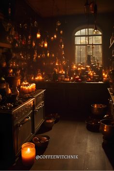 a kitchen filled with lots of lit candles