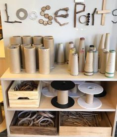 the sewing room has many different types of thread and spools on display in it