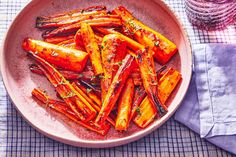 cooked carrots in a bowl on a table