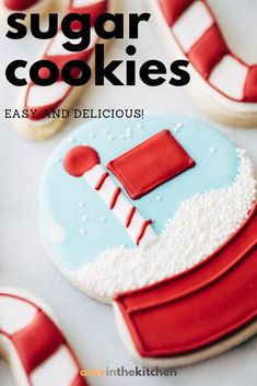 the cookies are decorated with red and white icing