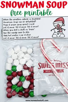 a bag of snowman soup with candy canes and marshmallows in it