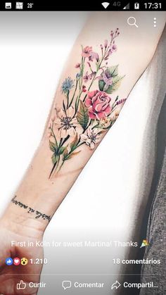 a person with a flower tattoo on their arm