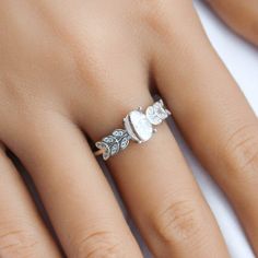 a close up of a person's hand with a ring on their finger,