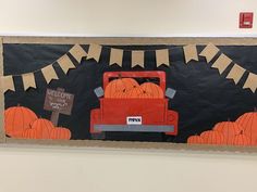 a bulletin board with pumpkins on it