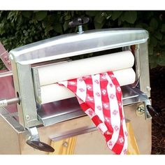 an american flag is hanging on the back of a cart with rolls of toilet paper