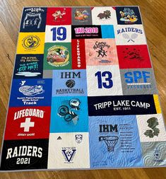 a quilt made to look like a basketball team's jersey is on the floor