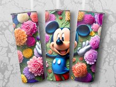 the mickey mouse tumbler is decorated with colorful flowers