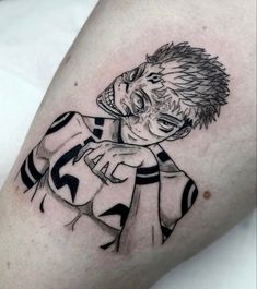 a man's arm with a black and white drawing of a boy on it