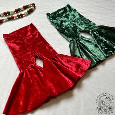 The cutest bells for your festive little babe! These are legging style pants with a high waisted, fold-over yoga waistband. Made from soft, crushed velvet, in either green or red. * If you are in between sizes, I suggest sizing up. * Need a size not listed, or another variation of this print? Feel free to message me for custom orders! Fitted Pants For Christmas Party, Fitted Bottoms For Christmas Holiday, Fitted Holiday Bottoms, Red Bottoms For Christmas Holiday, Festive Fitted Red Bottoms, Fitted Red Bottoms For Festive Occasions, Red Festive Bottoms For Winter, Red Festive Winter Bottoms, Festive Red Winter Bottoms