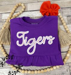 Girls custom tiger sweatshirt, custom embroidered Clemson sweatshirt, custom bubble sweatshirt, girls sweatshirt, Clemson fan shirt,  This is a Clemson tiger fan inspired sweatshirt for girls, it can be done for adults as well upon request for a small price increase. It is well stitch and hand trimmed. Special note from seller Hi, Thank you so much for your business and support of our passion to create custom designs for you! Please know it is our goal to give you the best quality and service we can!  IF YOU NEED THIS SHIPPED OUT FOR SURE WITHIN 2 DAYS PLEASE ADD THE RUSHED ORDER FEE SO THAT IT CAN BE MOVED TO THE FRONT OF MY ORDERS. I SOMETIMES DONT SEE MESSAGES OR COMMENTS ABOUT NEEDING THEM QUICKER SO THIS IS THE ONLY WAY I KNOW TO MAKE SURE IM AWARE!  It is our policy however, due to t Customizable Cotton Cheerleading Sweatshirt, Customizable Cotton Sweatshirt For Cheerleading, Customizable School Spirit Sweatshirt For Cheerleading, Customizable Tops For School Spirit In Fall, Clemson Sweatshirt, Custom Team Shirts, Clemson Fans, Tiger Embroidery, Team Sweatshirts