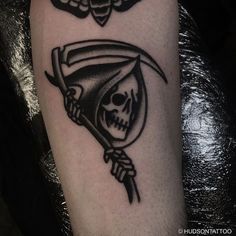 a skull with a sculler on it's arm