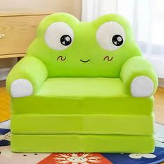 a green chair sitting on top of a wooden floor