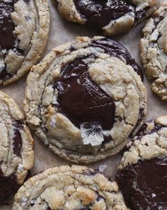 chocolate chip cookies are arranged on a baking sheet