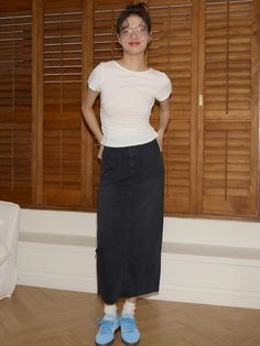 This product, the Straight Denim Long Skirt, is a versatile and timeless piece that combines the casual cool of denim with a more refined, elongated silhouette. The skirt's straight cut is flattering and easy to wear, while the raw hemline adds a touch of edgy style. It's a perfect choice for someone looking to add a classic yet contemporary item to their wardrobe. - The skirt's long length is balanced by a straight cut, offering both coverage and a sleek look.- Made from durable denim, this skirt is designed to withstand the test of time and trends.- A raw hemline at the bottom provides a modern detail that adds character to the simple design.- This denim skirt pairs effortlessly with a variety of tops, from casual tees to more formal blouses, making it a highly versatile garment. Classic Mid-rise Denim Skirt For Summer, Classic Cotton Relaxed Skirt, Fitted High Rise Classic Denim Skirt, Classic Fitted High Rise Denim Skirt, Classic Fitted High-rise Denim Skirt, Classic Dark Wash Cotton Denim Skirt, Casual Fitted Straight Leg Skirt, Mid-rise Cotton Skirt For Workwear, Classic High Rise Denim Skirt For Summer