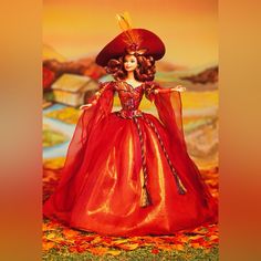 a doll in a red dress and hat