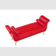 a red leather couch with gold legs and nail polishing on the top, sitting in front of a white background