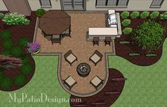 an aerial view of a patio with seating and fire pit in the middle of it