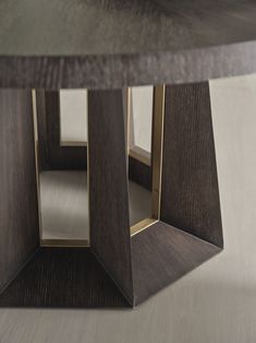 a close up of a wooden table with metal accents