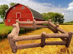 an image of a red barn and fence in the middle of a field with hay