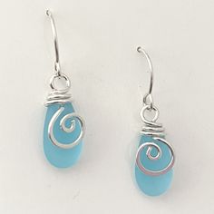 "Mermaid Tear Drop Earrings ~ 20 gauge, sterling silver wire ~ in a SPIRAL, accenting the matte glass. This is NOT beachglass, rather they are pressed beads from the czech republic. The glass does, however, look very much like beachglass They hang 1 1/4\" and are very light and super comfortable! A great, everyday earring, that evokes the spirit of the sea ~ Arrives, thoughtfully gift packaged on CRD printed earring card & artisan bio. Ready for gift giving! FREE SHIPPING in the USA" Silver Hypoallergenic Earrings With Sea Glass, Silver Hypoallergenic Sea Glass Earrings, Nickel-free Teardrop Earrings Made Of Recycled Glass, Nickel-free Teardrop Earrings In Recycled Glass, Hypoallergenic Silver Sea Glass Earrings, Nickel-free Sea Glass Earrings For Jewelry Making, Teardrop Sea Glass Earrings With Ear Wire, Nickel-free Silver Earrings With Recycled Glass, Nickel-free Silver Earrings In Recycled Glass