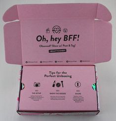 an open pink box that says oh hey beef on the front and bottom, with two different items in it