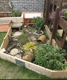 the garden is full of plants and rocks